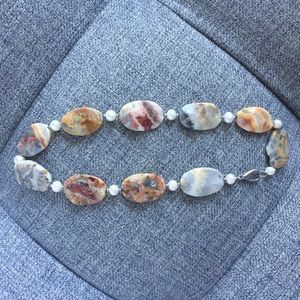 Polished stone and faux pearl necklace.